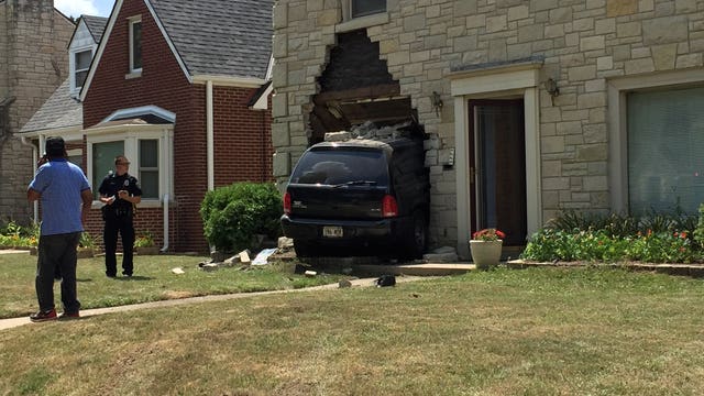 Vehicle strikes home after crash involving 2 vehicles near 51st & Vienna