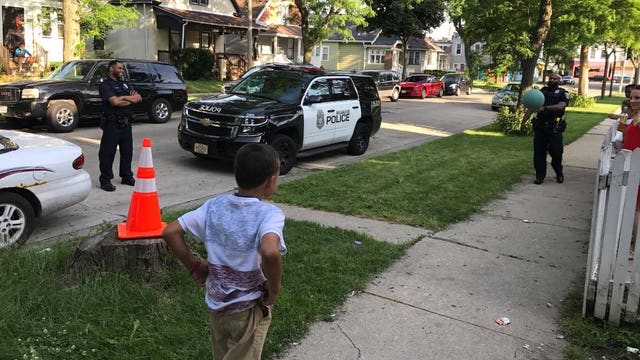Milwaukee police officers make time for game of 'Cans' with 10-year-old boy