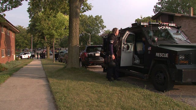 Police: Two in custody for armed robbery after suspect fled into apartment building