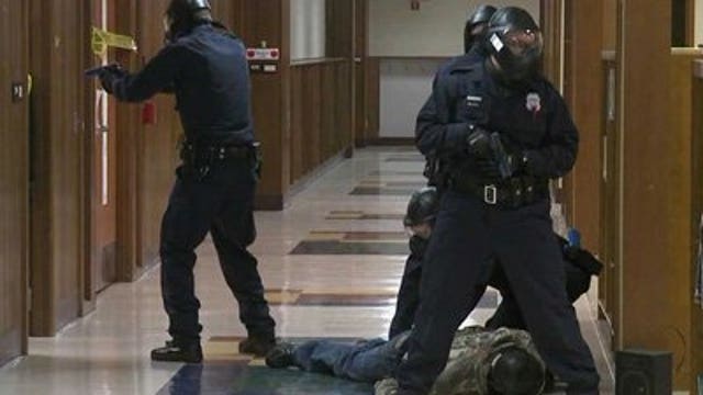 Police recruits take part in "active shooter training"