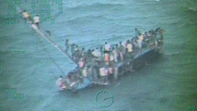 Ten dead, dozens rescued after Haitians' boat capsizes