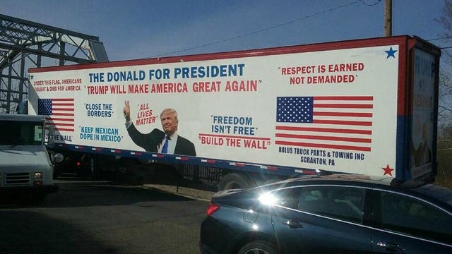 Tractor trailer advertising Trump gets stuck on bridge