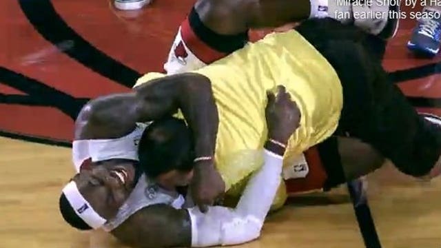 FOX6 Web Fix: NBA fan sinks half-court shot, tackled by LeBron James