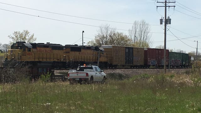 Train cars derail, spark small brush fire on Milwaukee's far northwest side