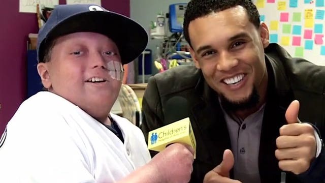 Paying it forward: Brewers outfielder Carlos Gomez shares time with young cancer patient
