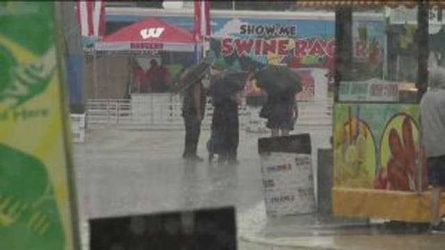 "We're just going to get wet:" Showers didn't dampen spirits at opening day of State Fair