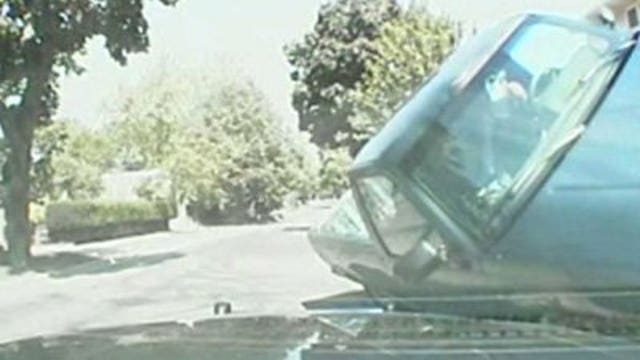 Woman pleads not guilty to charges after nearly hitting police squad