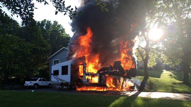 Travel trailer engulfed in flames in the Village of Richfield, nobody hurt