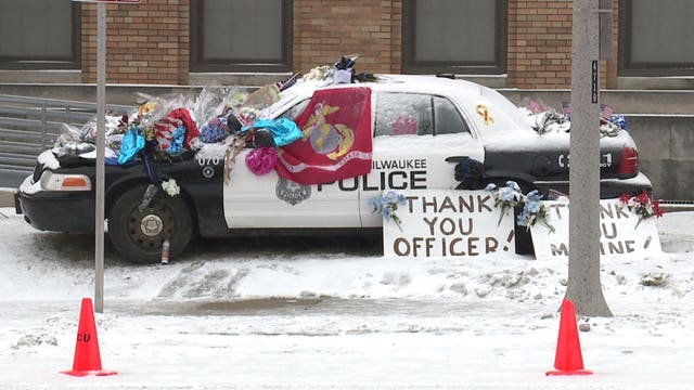 Strangers pay respects to Officer Rittner at memorial at 47th and Vliet: 'It's just a shame'