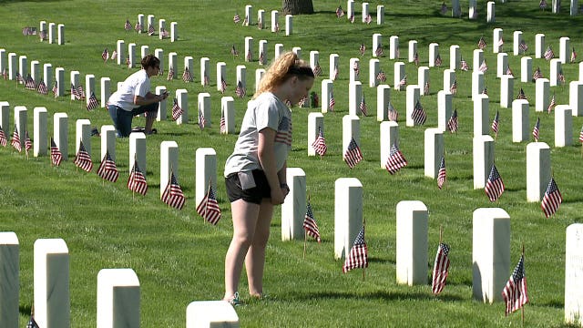 Volunteers, students place 35K+ flags at graves of fallen at Wood National Cemetery