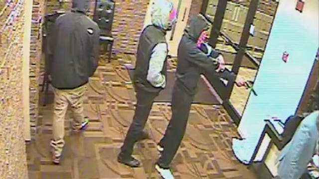 Video: 3 suspects rob man at gunpoint inside apartment building on Milwaukee's east side