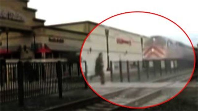 CAUGHT ON CAM: Man nearly struck by speeding train