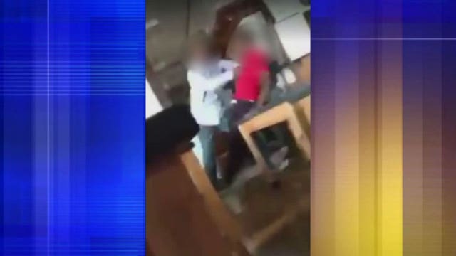 Bay View teacher's aide booked into jail; awaiting charges after video showed him pushing student