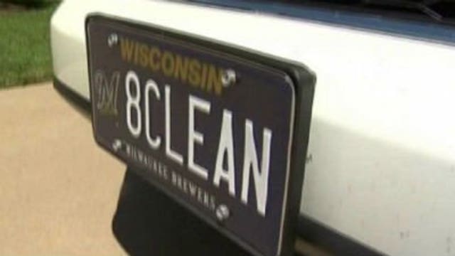 Eau Claire man removes Braun-themed "8-CLEAN" license plate