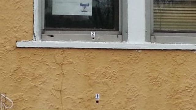 Police: Woman struck by bullet while lying on couch