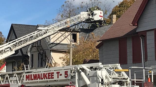 Milwaukee firefighters battle house fire near 10th and Locust