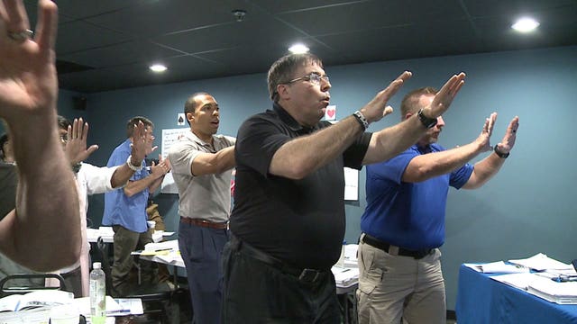 Local company teaches law enforcement, professionals how to deal with "entire spectrum of human conflict"