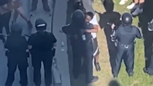 Video shows man hugging officers outside MPD headquarters in downtown Milwaukee during protest