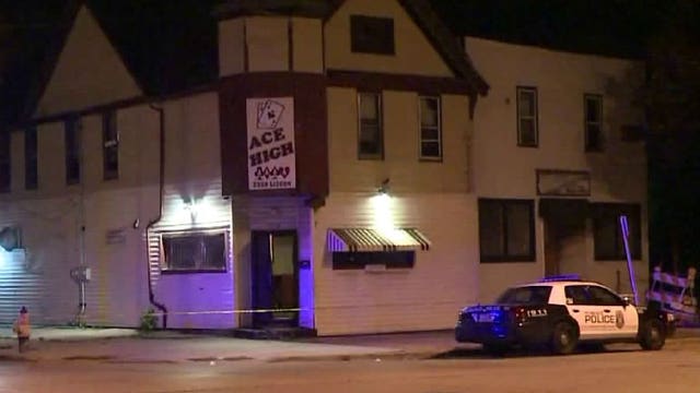 Man found shot to death in street; police seek motive and search for suspects