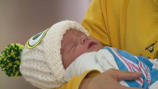 Newborns at Aurora Women’s Pavilion get green and gold hats; "You have to start your Packers fans early"