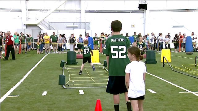 Kids join Green Bay Packers players for "Junior Power Pack Kids Clinic"