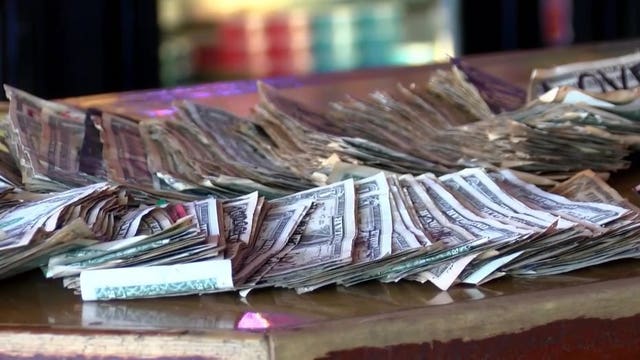Over $3,000 worth of bills stapled to walls removed at Georgia bar to give to unemployed staff