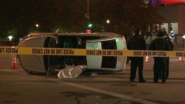 Two hurt, one in custody after rollover crash in downtown Milwaukee