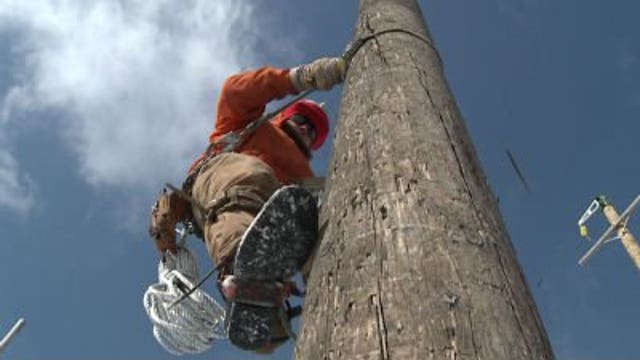 We Energies crews work to restore power during extreme wind