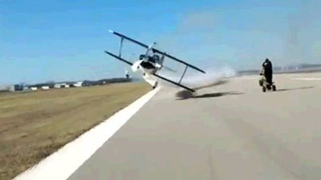 Video of stunt plane barely missing two people prompts FAA probe