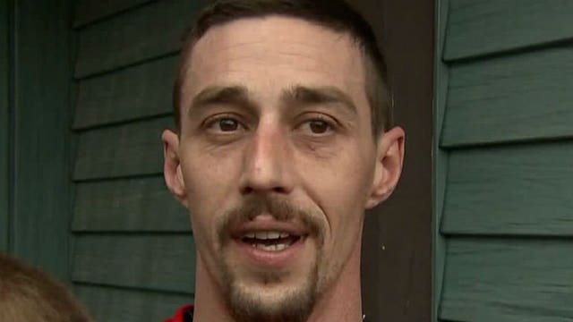 Wild ride: Man hangs onto his wife's stolen SUV for blocks, but suspects got away