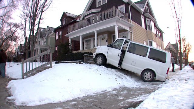 "It was crazy:" Man taken to the hospital after crashing van into porch near Locust & Farwell