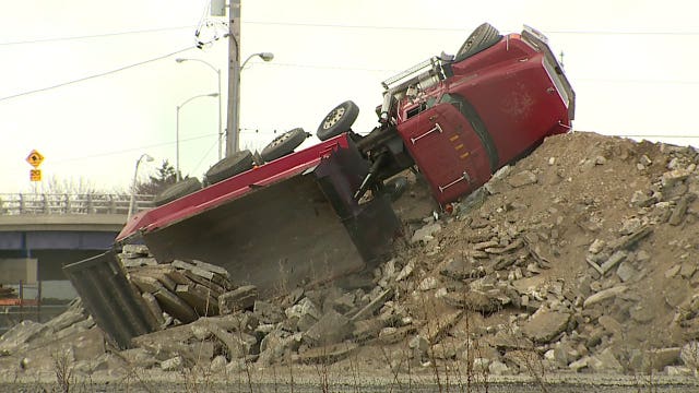 Milwaukee firefighters rescue driver that rolled dump truck