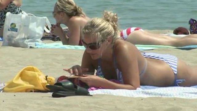 Extreme heat is not keeping people from golf courses, beach