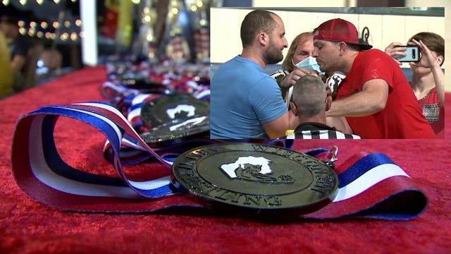 'Washing our hands:' Intimate sport of arm wrestling draws 200+ pullers to state tourney despite pandemic