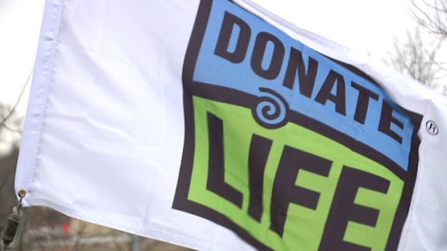 'I'm thankful:' Flag-raising ceremony, moment of silence held honoring organ, tissue and eye donors