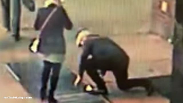 'Wanted for dropping his fiancee's ring!' NYPD seeks couple after it fell through grate during proposal