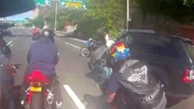 Biker who swung helmet in SUV attack 'overreacted' but didn't beat driver, lawyer says
