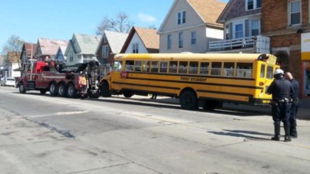 Car collides with school bus filled with students