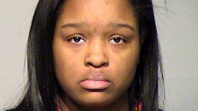 Woman charged in fatal stabbing; says victim stated "I tripped," fell on butcher knife