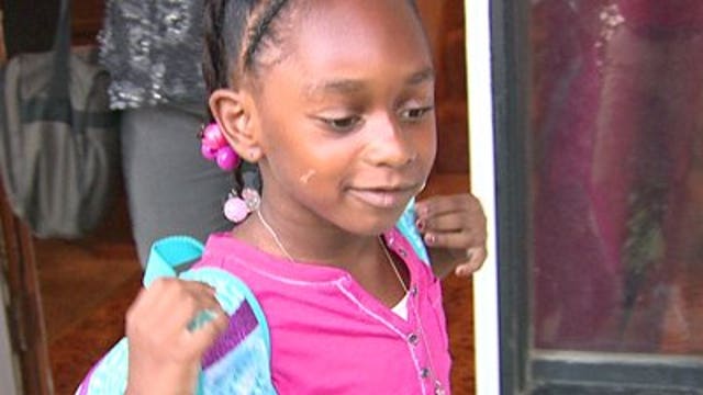 Teacher sends first-grade, high school children off to first day of school