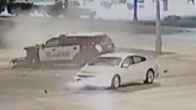 Surveillance video shows collision involving MPD squad that left newlyweds seriously hurt