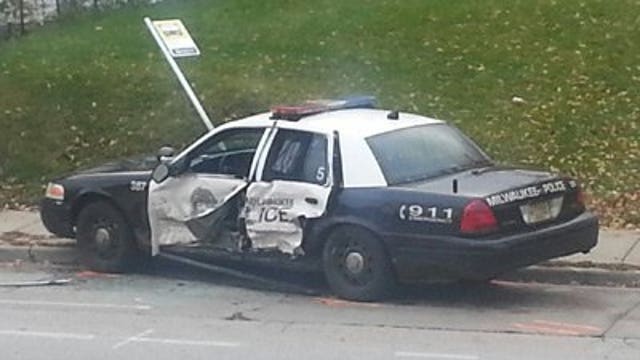 Police investigate collision between squad, car