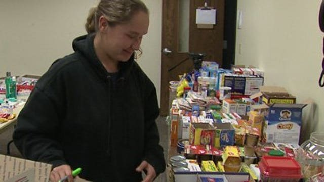 Easter Seals volunteers prepare care packages for troops