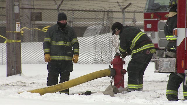Searching for hot spots: Firefighters monitor what remains of tire recycling fire