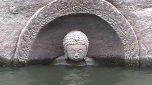 Sunken, 600-year-old Buddha emerges from water in China