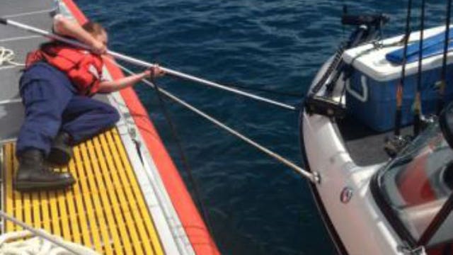 Rescued: Coast Guard and Good Samaritan assist two men after their boat took on water