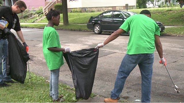 Police officers and neighbors work towards a common goal for Community Action Day