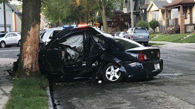 4 injured after vehicle hits tree, catches fire near 20th and Lapham in Milwaukee