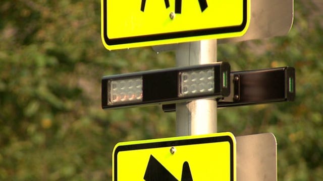 "There will be more kids out:" New flashing beacon signs installed at three school crosswalks
