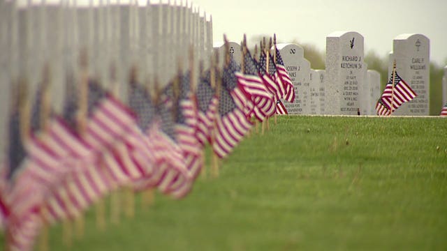 Honoring the fallen: Volunteers place thousands of flags at veterans cemetery ahead of Memorial Day
